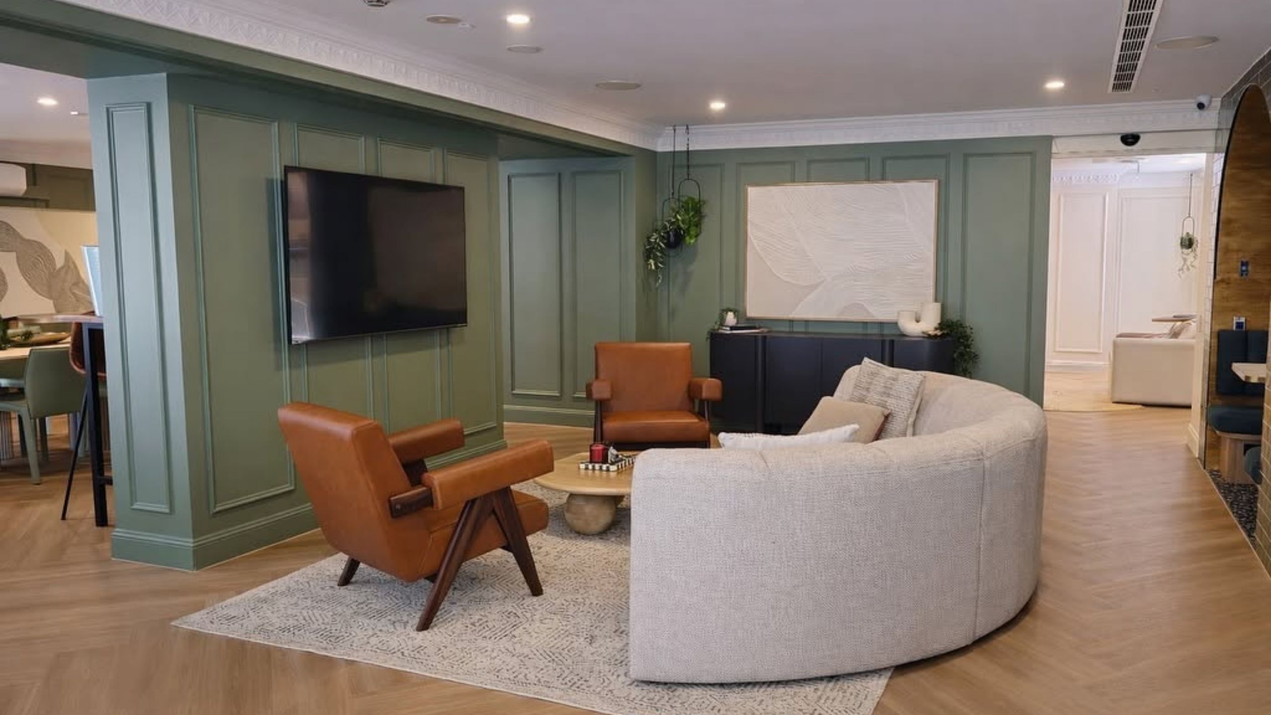 New build joinery by 10X Joinery in Sydney with sage green wall panelling and built-in TV wall