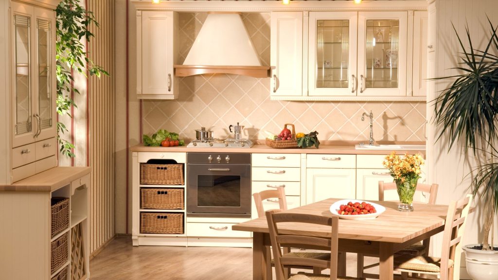 A classic cream country-style kitchen with glass-front cabinets and wicker basket drawers in a Castle Hill home, renovated by 10X Joinery.