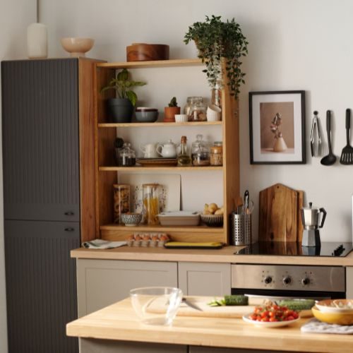 A compact Auburn kitchen with timber open shelving, a fluted grey pantry cabinet and butcher block island, designed and installed in-house by 10X Joinery.