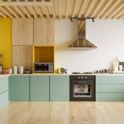 A family kitchen in an established Castle Hill home with sage green cabinets, light timber overheads and a slatted timber ceiling by 10X Joinery.