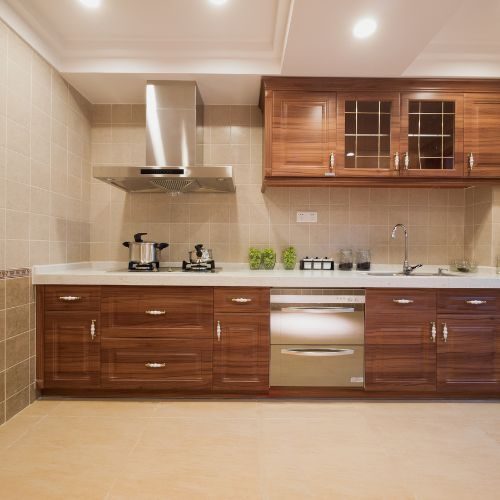 A standard builder-grade timber-look kitchen in a newer Castle Hill home, ready to be replaced with custom cabinetry by 10X Joinery.