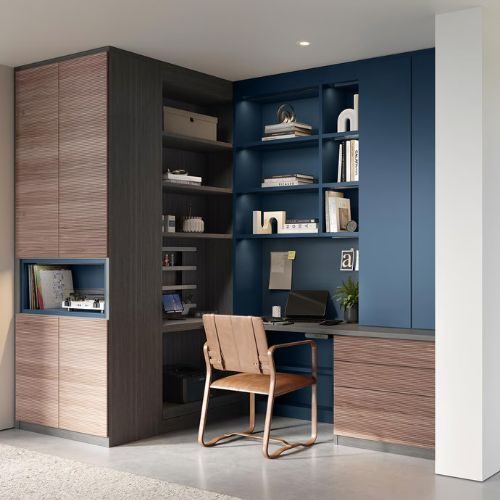 Custom home office cabinets in a Sydney home, with a navy built-in desk, open shelving and tall timber-grain storage by 10X Joinery.