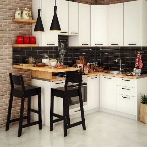 A white shaker kitchen with black subway tiles, exposed brick and a timber breakfast bench, installed in Baulkham Hills by 10X Joinery.