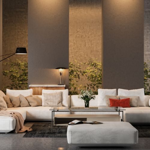 A Sydney living room with a full-height panelled feature wall behind a sectional sofa, designed and installed in-house by 10X Joinery.