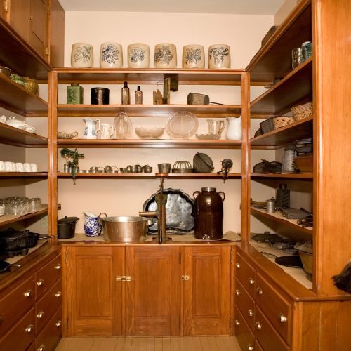 A timber walk-in pantry with open shelving, cupboards and deep drawers, custom built for a Blacktown kitchen by 10X Joinery.