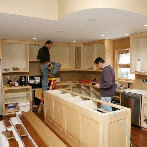 The 10X Joinery team installing new kitchen cabinetry and an island during a complete kitchen renovation in Baulkham Hills.