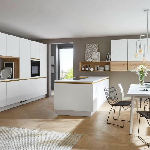 A white handleless kitchen with a coordinated splashback, timber open shelf and island in a Castle Hill home by 10X Joinery.