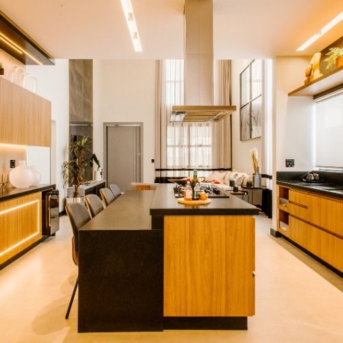 A modern Blacktown kitchen upgrade with timber and black cabinetry, a central island and LED strip lighting by 10X Joinery.