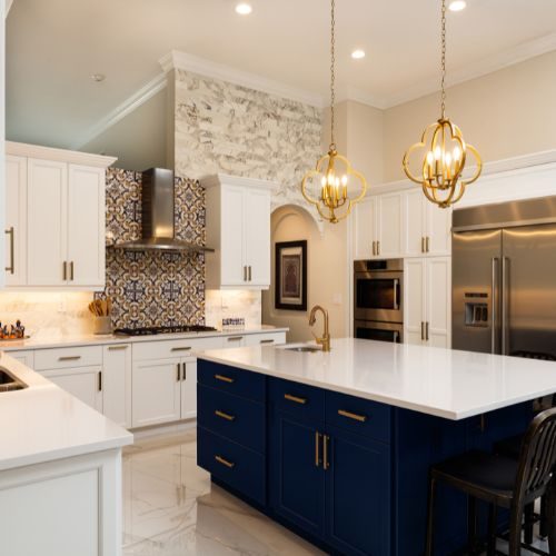 A white kitchen with a navy island and patterned splashback, built in our Castle Hill workshop near Blacktown by 10X Joinery.